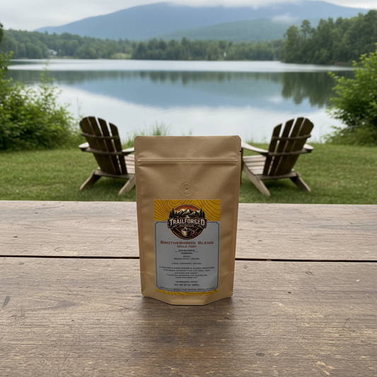 Coffee package on a wooden table by a lake with chairs in the background